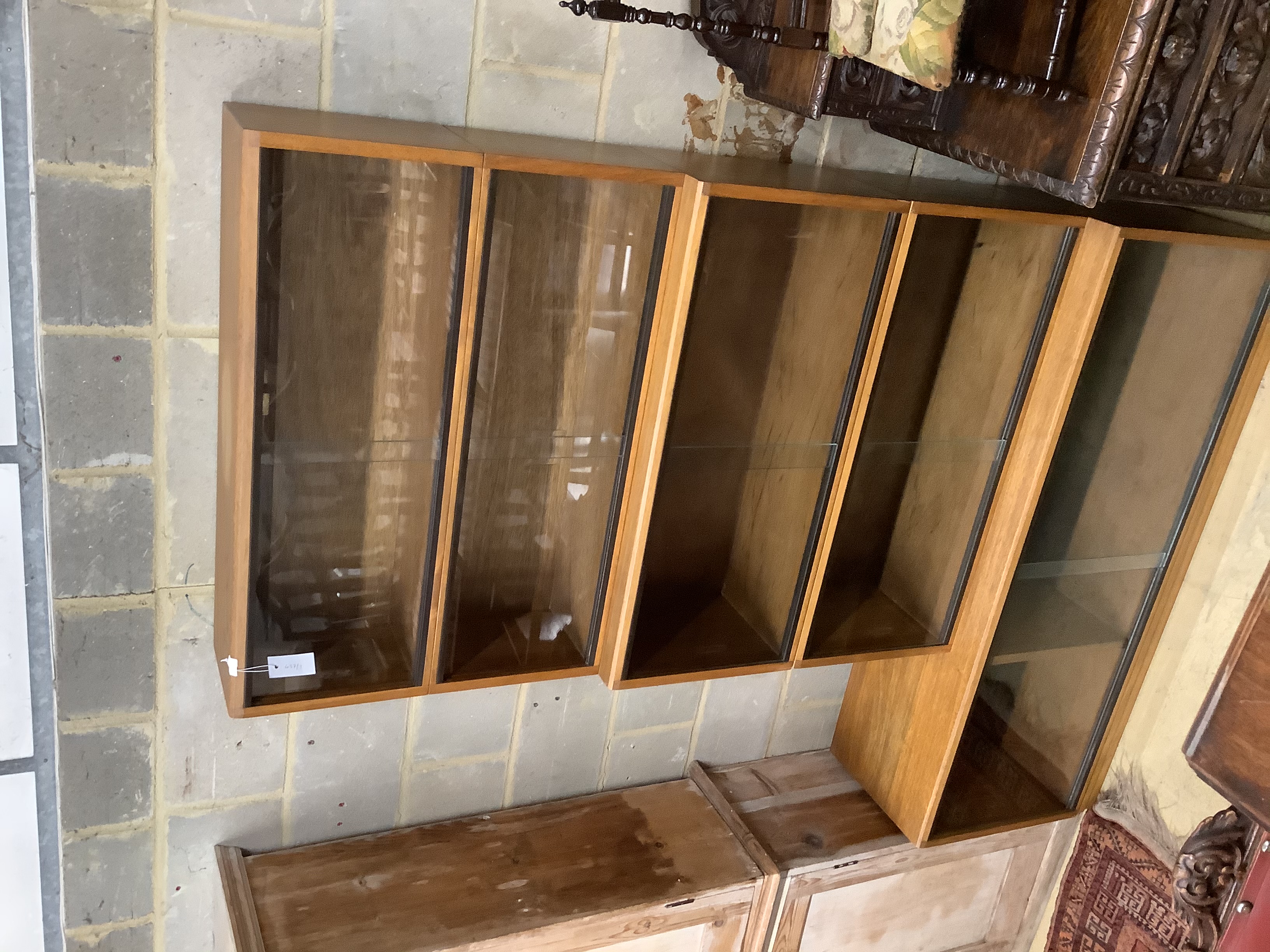 A Simplex teak five section bookcase, width 137cm, depth 35cm, height 198cm